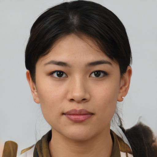 Neutral asian young-adult female with medium  brown hair and brown eyes