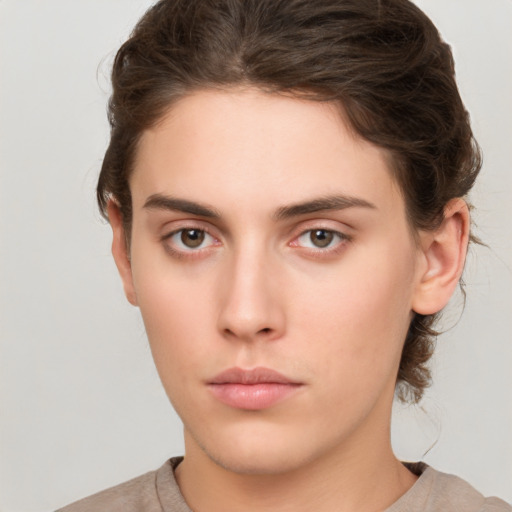 Neutral white young-adult female with short  brown hair and brown eyes