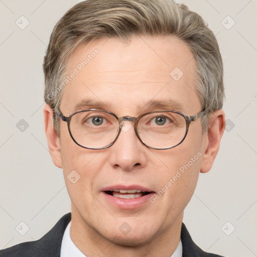 Joyful white adult male with short  brown hair and grey eyes