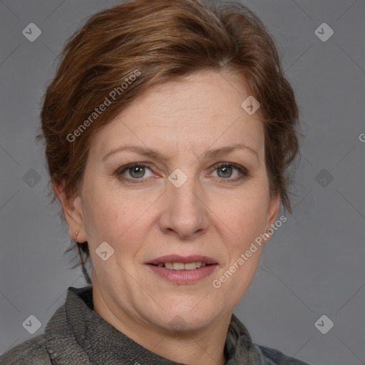 Joyful white adult female with medium  brown hair and blue eyes