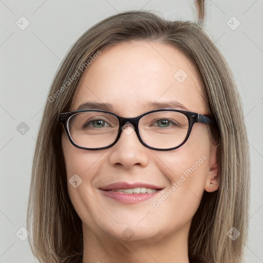 Joyful white young-adult female with long  brown hair and blue eyes