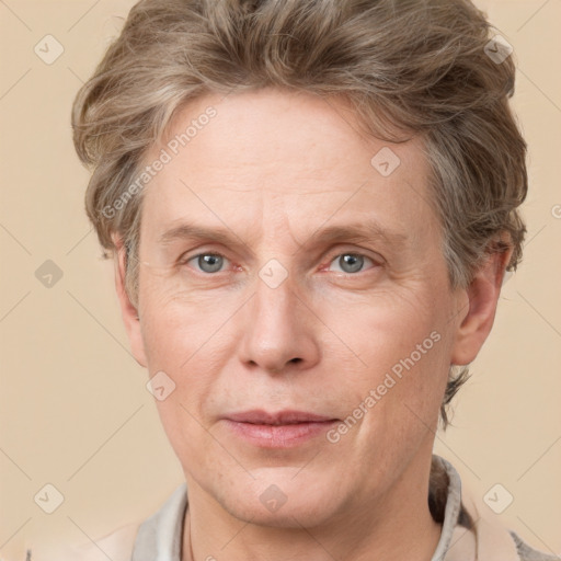 Joyful white adult male with short  brown hair and grey eyes