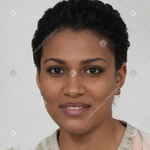 Joyful black young-adult female with short  black hair and brown eyes