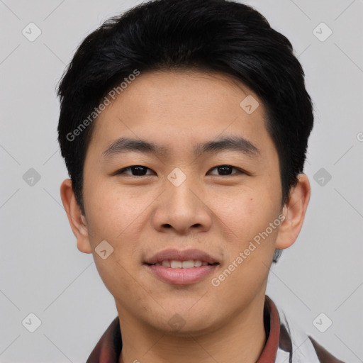 Joyful asian young-adult male with short  black hair and brown eyes