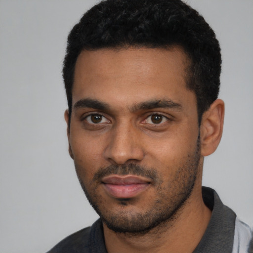 Neutral black young-adult male with short  black hair and brown eyes