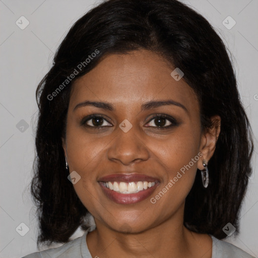 Joyful black young-adult female with medium  brown hair and brown eyes