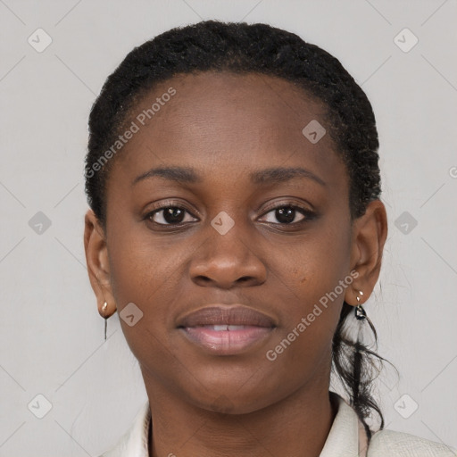 Joyful black young-adult female with short  brown hair and brown eyes