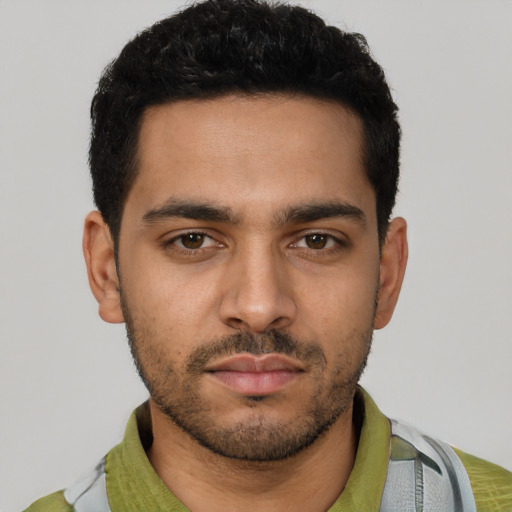 Neutral latino young-adult male with short  black hair and brown eyes