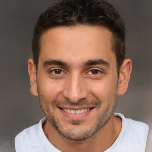 Joyful white young-adult male with short  brown hair and brown eyes