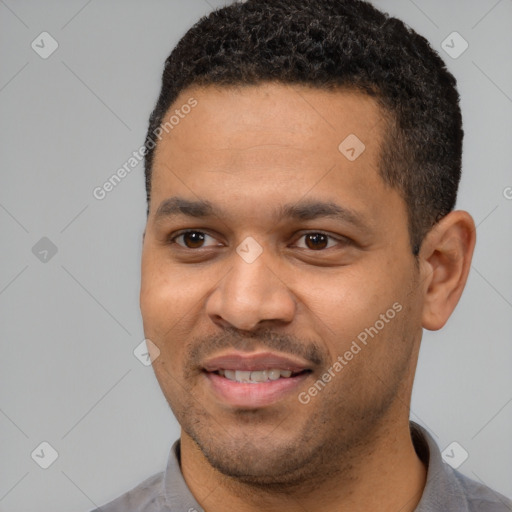 Joyful latino young-adult male with short  black hair and brown eyes