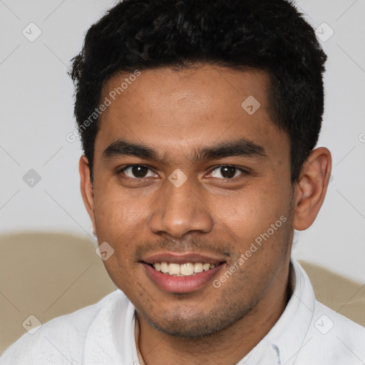 Joyful latino young-adult male with short  brown hair and brown eyes