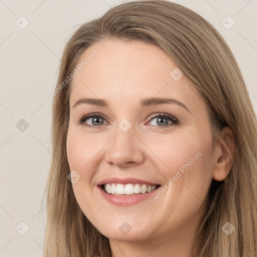 Joyful white young-adult female with long  brown hair and grey eyes