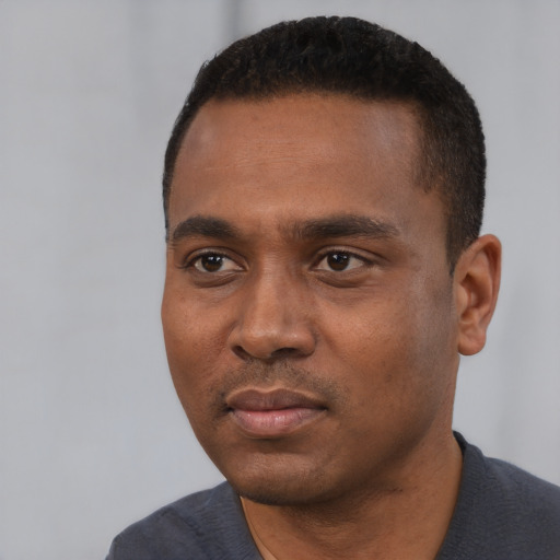 Neutral black young-adult male with short  black hair and brown eyes