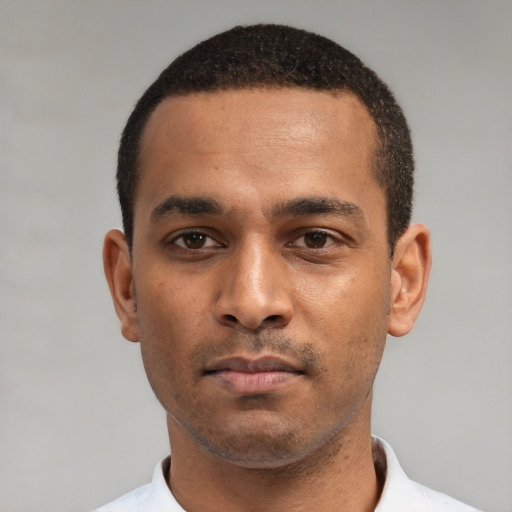 Neutral black young-adult male with short  black hair and brown eyes
