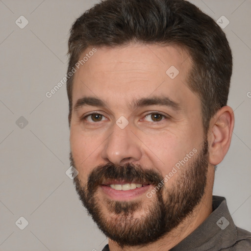 Joyful white adult male with short  brown hair and brown eyes