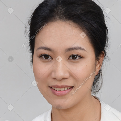 Joyful asian young-adult female with medium  brown hair and brown eyes