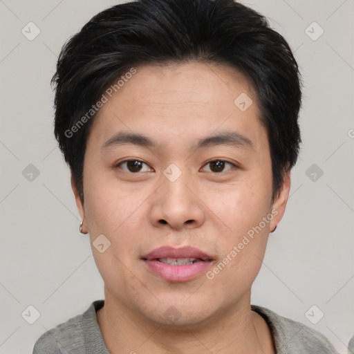 Joyful asian young-adult male with short  brown hair and brown eyes