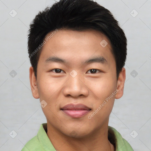 Joyful asian young-adult male with short  black hair and brown eyes