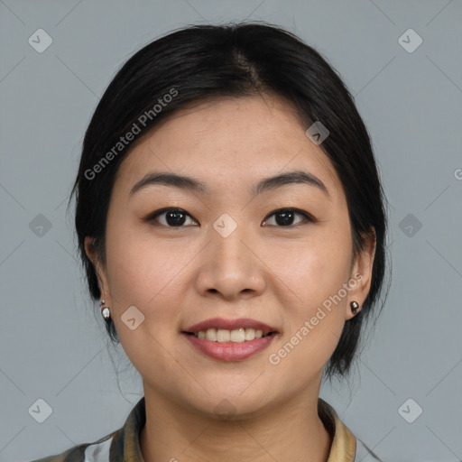 Joyful asian young-adult female with medium  black hair and brown eyes