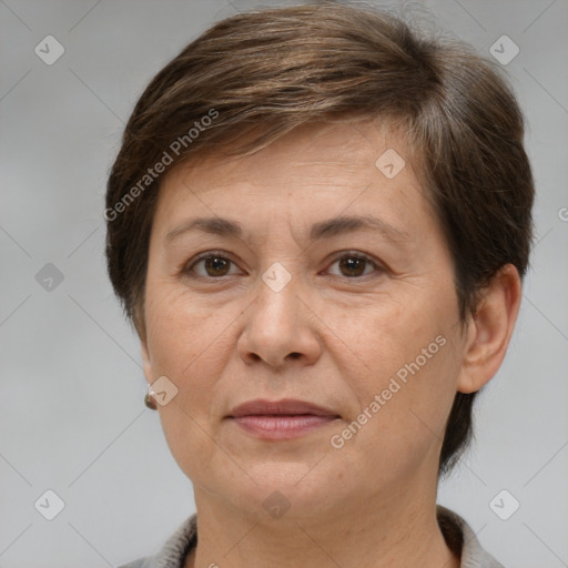 Joyful white adult female with short  brown hair and brown eyes