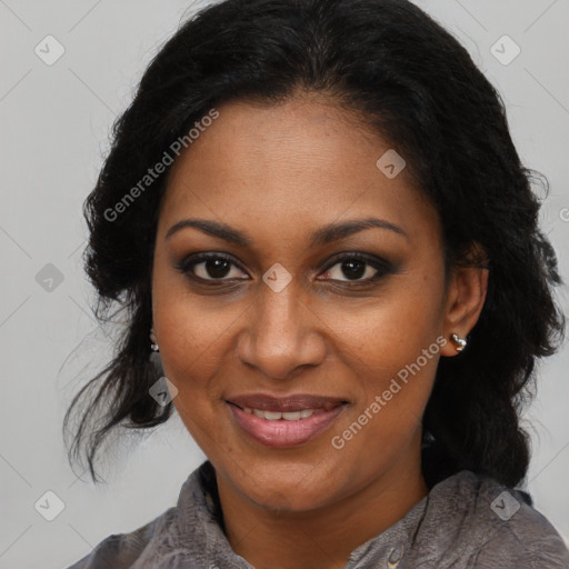 Joyful black adult female with medium  brown hair and brown eyes