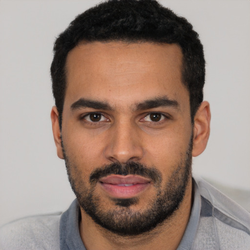 Neutral latino young-adult male with short  black hair and brown eyes