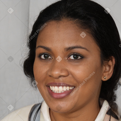 Joyful black young-adult female with medium  black hair and brown eyes