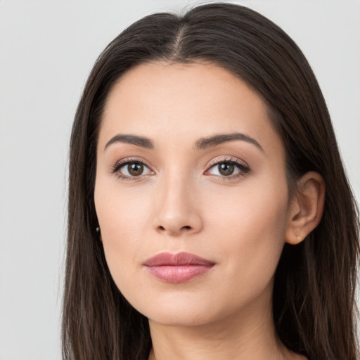 Neutral white young-adult female with long  brown hair and brown eyes