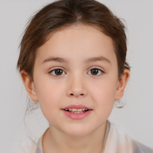 Joyful white child female with short  brown hair and brown eyes