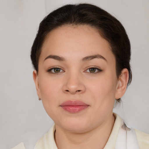 Joyful asian young-adult female with medium  brown hair and brown eyes