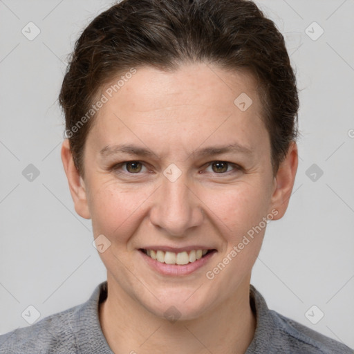 Joyful white adult female with short  brown hair and grey eyes