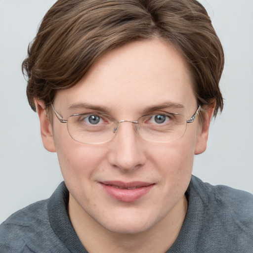 Joyful white adult female with short  brown hair and blue eyes