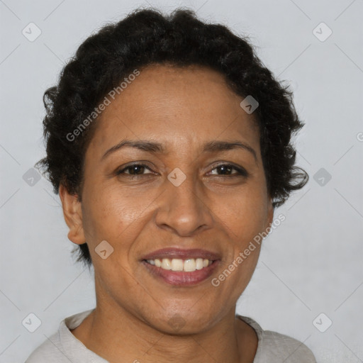 Joyful black adult female with short  brown hair and brown eyes