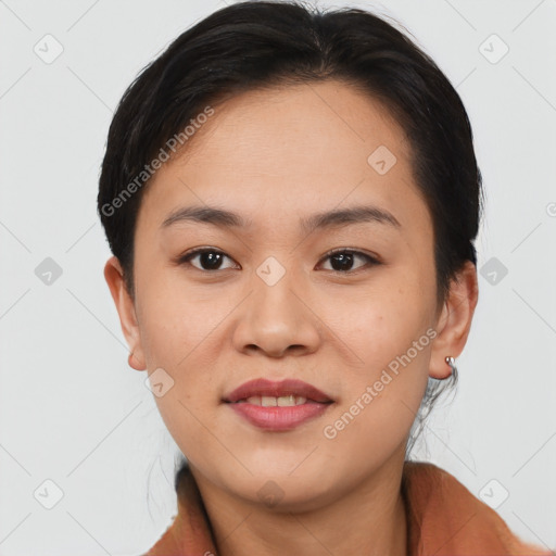 Joyful asian young-adult female with short  brown hair and brown eyes