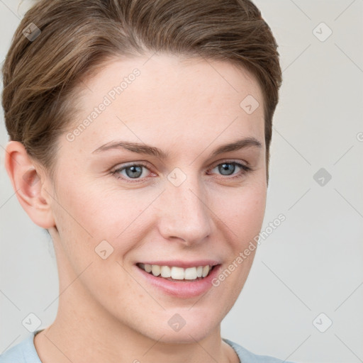 Joyful white young-adult female with short  brown hair and grey eyes