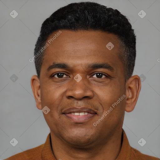 Joyful black young-adult male with short  black hair and brown eyes