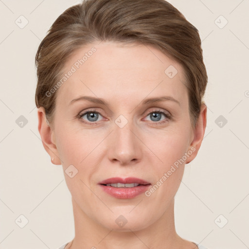 Joyful white young-adult female with short  brown hair and grey eyes