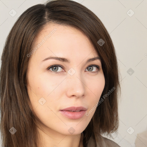 Neutral white young-adult female with long  brown hair and brown eyes