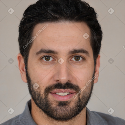 Joyful white young-adult male with short  black hair and brown eyes