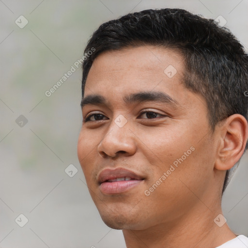 Joyful asian young-adult male with short  black hair and brown eyes