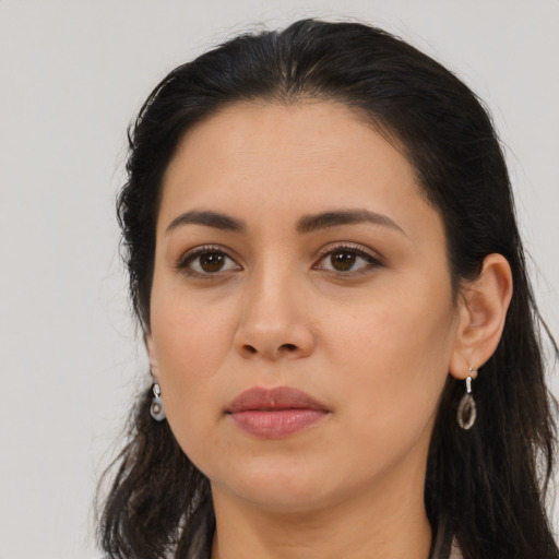 Neutral latino young-adult female with long  brown hair and brown eyes