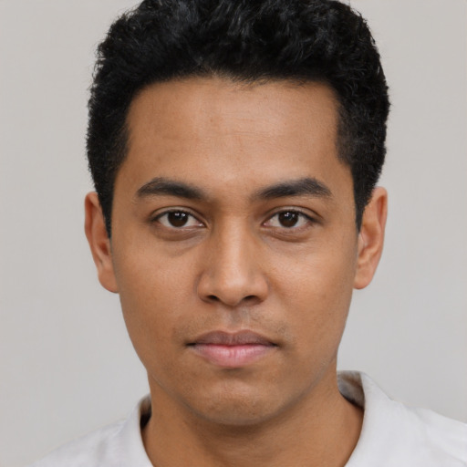 Neutral latino young-adult male with short  black hair and brown eyes