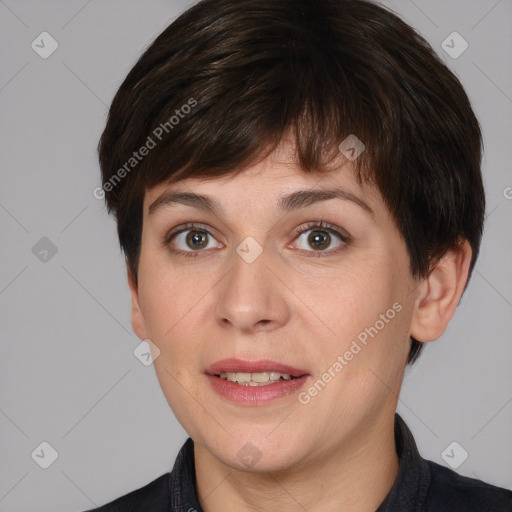 Joyful white adult female with short  brown hair and brown eyes