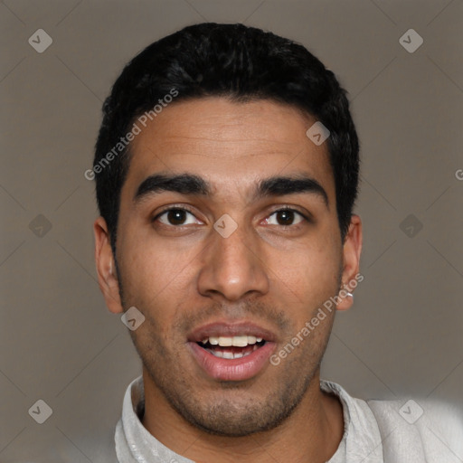 Joyful latino young-adult male with short  black hair and brown eyes