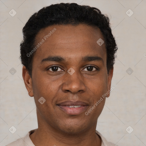 Joyful black young-adult male with short  black hair and brown eyes