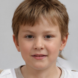 Joyful white child male with short  brown hair and brown eyes