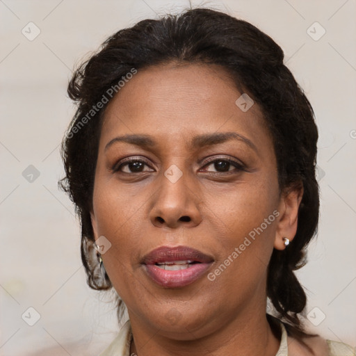 Joyful black adult female with medium  brown hair and brown eyes