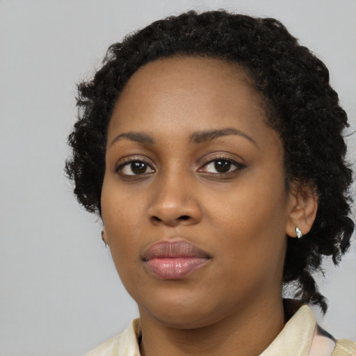 Neutral black young-adult female with medium  black hair and brown eyes