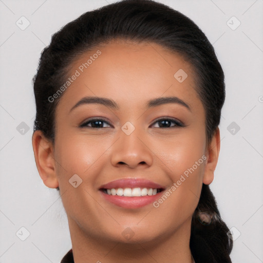 Joyful latino young-adult female with long  brown hair and brown eyes