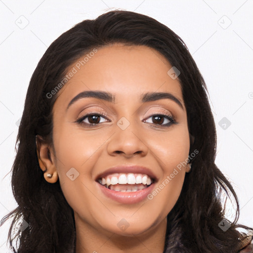 Joyful latino young-adult female with long  black hair and brown eyes